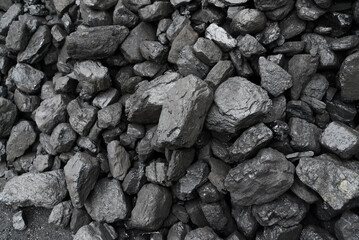 The texture of pieces of coal lying on top of each other.