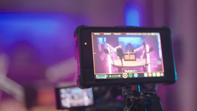 Professional camera screen record podcast set with pink neon lights zoom out 4K