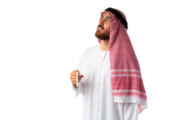Young Arab man in traditional clothes holding beads isolated on white background