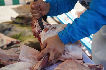 Almaty, Kazakhstan - 10.15.2022 : Preparation of beef meat for sale on the market.