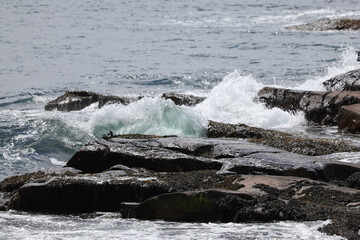 Ocean waves splashing on a rocky shore