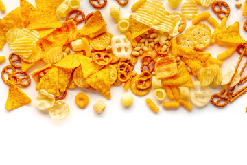 Salty snacks on white. Potato and tortilla chips, salt crackers etc, shot from the top with copy space. Party food mix - obrazy, fototapety, plakaty