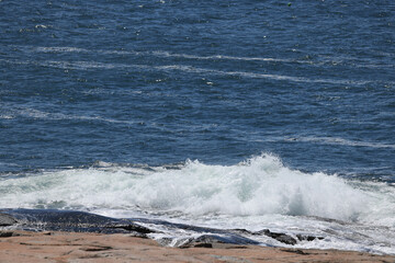Ocean crashing onto a rocky shore