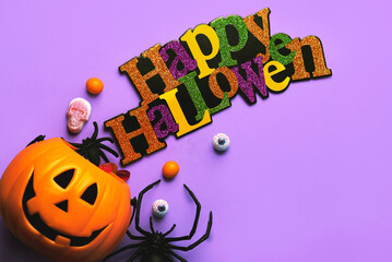 Happy Halloween. Top view of Halloween pumpkin basket full of candies and decoration Halloween party. Halloween concept background