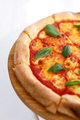 Classic Italian pizza margherita with mozzarella and basil