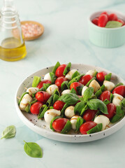 A plate with Italian salad caprese canape	