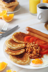 Traditional British breakfast with sausages and beans