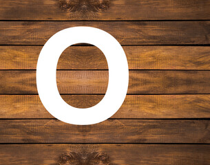 Alphabet letter O in white hole on wood background