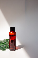 Brown Skincare Bottle with Leaf. Organic Natural  Beauty Product. Herbal Alternative Medicine. Beauty Cosmetic.