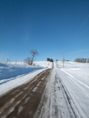 Fototapeta na wymiar snow covered country road