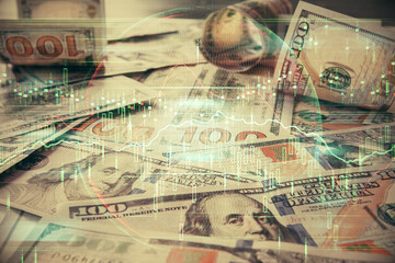 Multi exposure of forex chart drawing over us dollars bill background. Concept of financial success markets.
