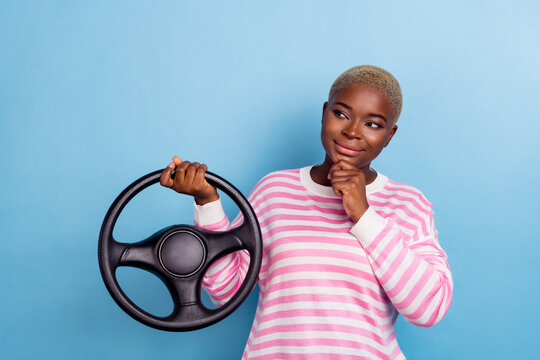 Portrait of questioned woman girl hand finger arm touch face chin striped outfit consider road isolated on blue color background
