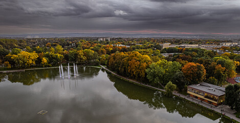 Drone view, aerial, landscape with lake (pond, lagoon), fountains and clouds - Zalew Nowohucki,...