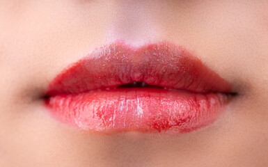 A woman's lips with red lipstick