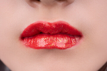 A woman's lips with red lipstick