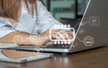 Woman using laptop with cloud computing diagram showing. Cloud technology, storage, network and internet service concept.