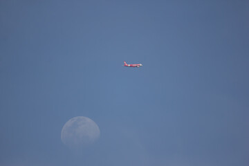 Passenger Airplane and the moon