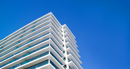 High-rise beautiful buildings, houses, hotels on the embankment of Batumi, Georgia, against the background of a blue sky