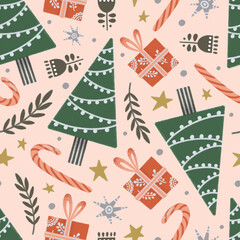 Christmas trees, candy canes and presents seamless pattern on pink background 