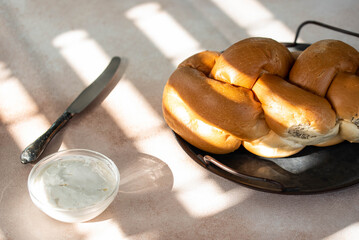 Fototapeta premium Challah Shabbat braided bread with silver knife and cottage cheese. Traditional Meal for Jewish cuisine Friday or Saturday dinner. 