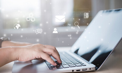 Obraz premium businessman hand type on the laptop of company profit with colleagues partner explain with virtual dashboard statistic chart stock infographic, graphs, cryptocurrency, and new trading platforms
