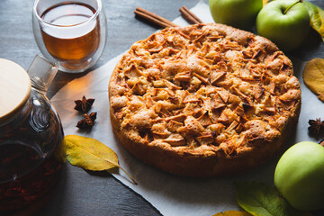 Apple pie with cinnamon. Charlotte, a sweet dessert made from apples baked in dough