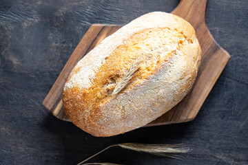freshly baked bread on wooden cutting board