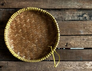 Plate from bamboo on wood background 