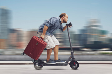 Traveller man riding an electric scooter