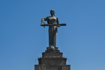 View of Mother Armenia Statue on sunny day on the background of blue sky. Yerevan, Armenia.