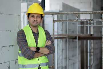 portrait of asian construction worker looking at camera