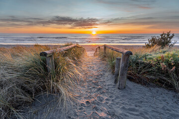 Beautiful sunrise at New Brighton Beach, Christchurch, New Zealand  - obrazy, fototapety, plakaty