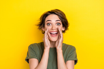Photo of pretty gorgeous optimistic girl with bob hairstyle wear khaki t-shirt hands near mouth...