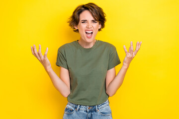 Photo of unhappy angry upset girl with bob hairstyle wear khaki t-shirt loud screaming in rage...