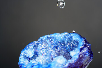 Quartz with mineral crystals against a black background
