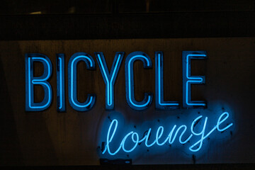 Copenhagen, Denmark A sign for a bicycle lounge in blue neon, or a bike parking garage.