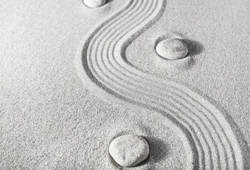 Fototapeta na wymiar Zen Garden with light sand, stones and waves