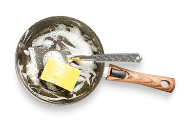 Frying pan with detergent foam. Washing dishes after cooking