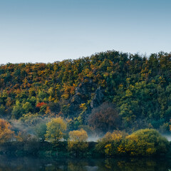 a close up of a hill above river