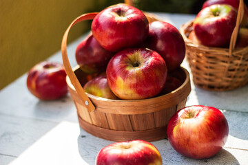 Red apples in wooden wicker basket