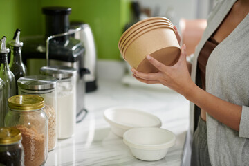Woman Taking Biodegradable Bowls