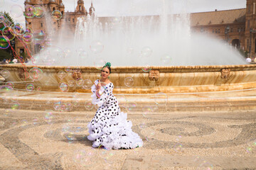 Flamenco dancer woman, teenage brunette and beautiful typical Spanish dancer is dancing between...