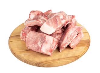 Fresh pork meat with bones on a cutting board isolated on white background.