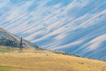 Old abandoned power transmission tower on Aragats Mount slope, Armenia.