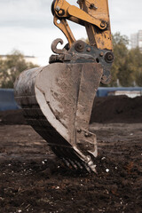 Excavator earth mover scoop. Road construction.