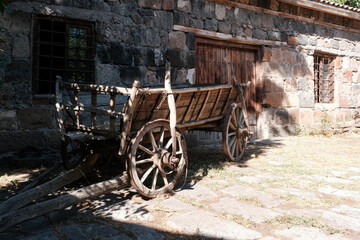 Fototapeta na wymiar An old cart at a traditional barn. Ashtarak, Armenia.