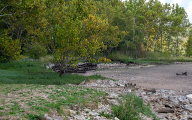 Dry edge of Arkansas river with wood fence