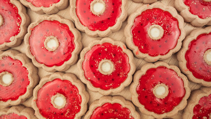 Sweet biscuits with red jam filling collection top view.