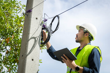 Engineer or technician are checking code numbers of fiber optic cable lines for maintenance.