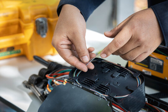 Engineer or technician are install fiber optic cable lines for maintenance.
